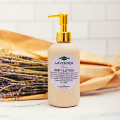 Lavender body lotion bottle with gold pump on a white background